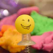 image of a yellow ball with a smiling face on it